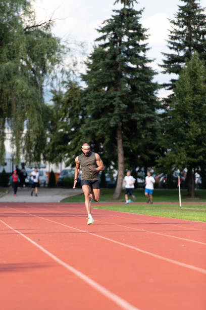 istock Young Male Athlete Running on Track 1251517414