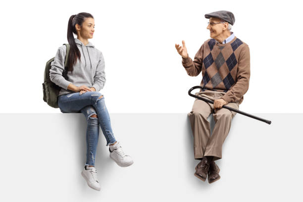 istock Female student sitting on a panel and listening to an elderly man talking 1251520797