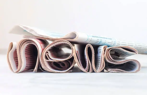 Photo of the word news is written from Newspapers, the concept of news from printed publications