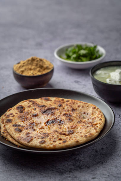 istock stuffed sattu paratha with homemade curd for breakfast 1251521963