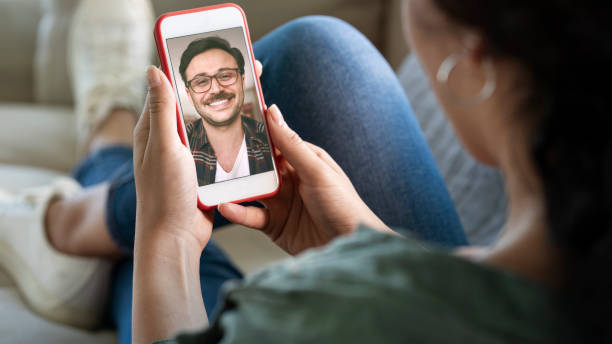 istock Young woman using smartphone for video call 1251522048