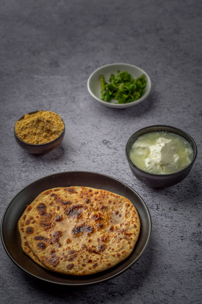 istock stuffed sattu paratha with homemade curd for breakfast 1251522218