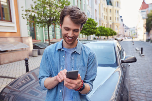 istock Joyful handsome male is chatting on smartphone 1251523348