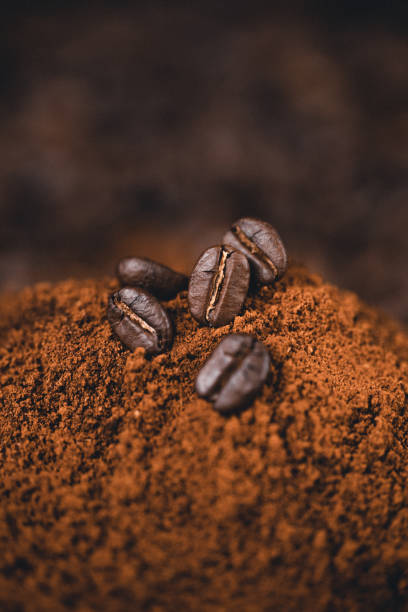 istock Ground coffee  on the background, roasted coffee beans 1251524687