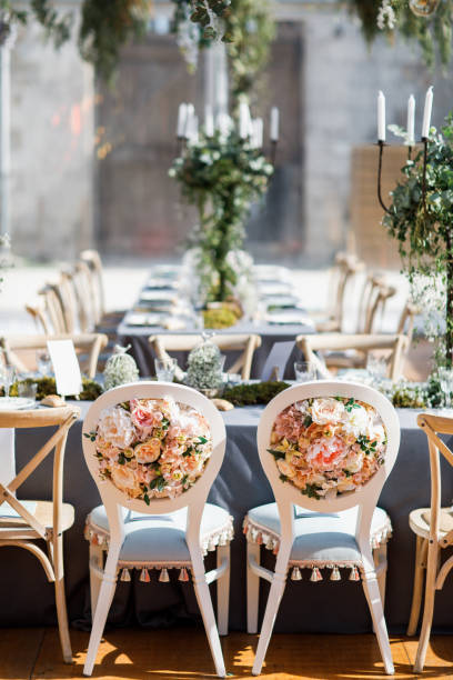 istock wedding table decorated by plates, knives and forks, candle, moss and greenery 1251524956