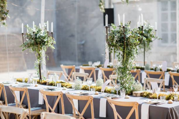 istock wedding table decorated by plates, knives and forks, candle, moss and greenery 1251524958