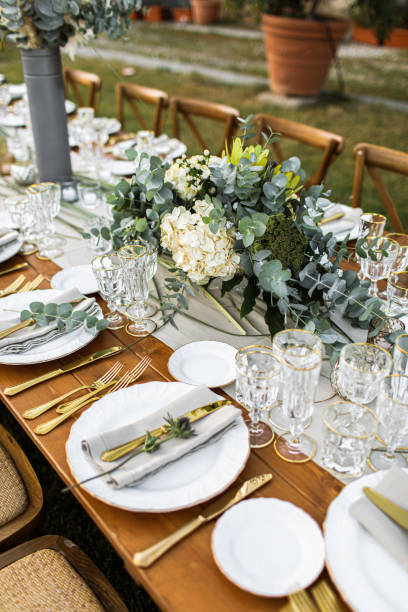 istock Decorated plate with fork and spoon. Table set up in boho style with pampas grass and greenery 1251525032