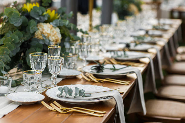 istock Decorated plate with fork and spoon. Table set up in boho style with pampas grass and greenery 1251525036