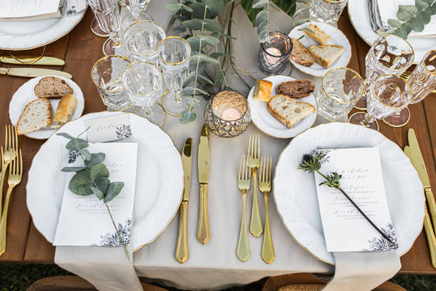 istock Decorated plate with fork and spoon. Table set up in boho style with pampas grass and greenery 1251525045