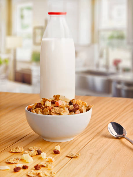 istock Milk bottle and fruity crispy on the kitchen table. 1251525407