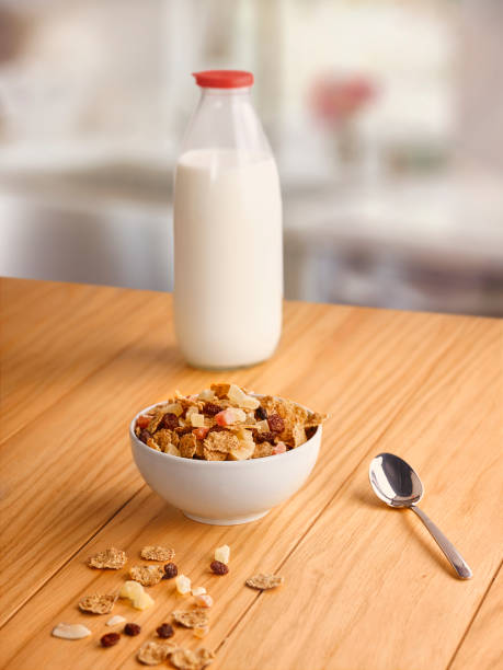 istock Milk bottle and fruity crispy on the kitchen table. 1251525718