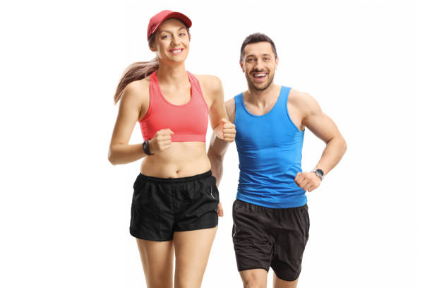 istock Young man and woman jogging towards camera 1251526953