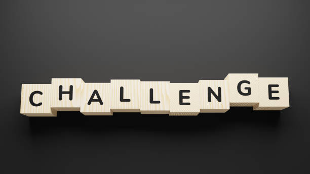 istock CHALLENGE word on a wooden blocks. 1251528048