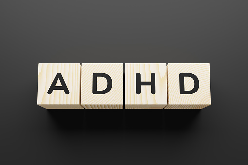 ADHD word on a wooden blocks.
