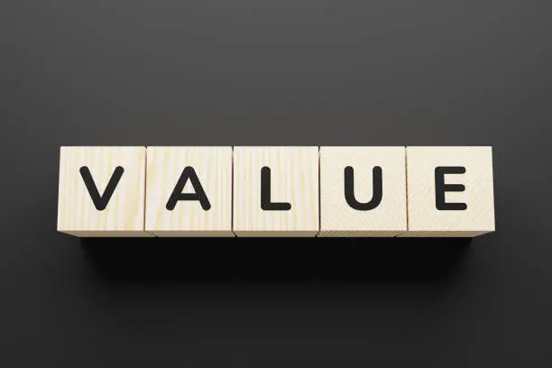 Photo of VALUE word on a wooden blocks.
