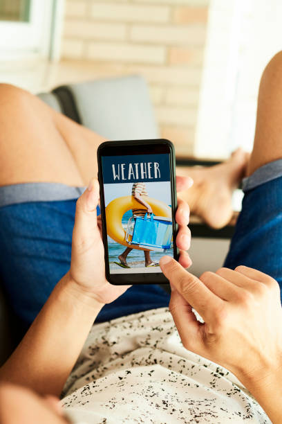 istock man and text weather in his smartphone 1251528597