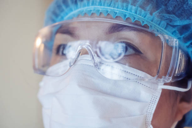 istock Reflection CT examination image on eyeglasses, Doctor Looking at Computer Monitor 1251530229