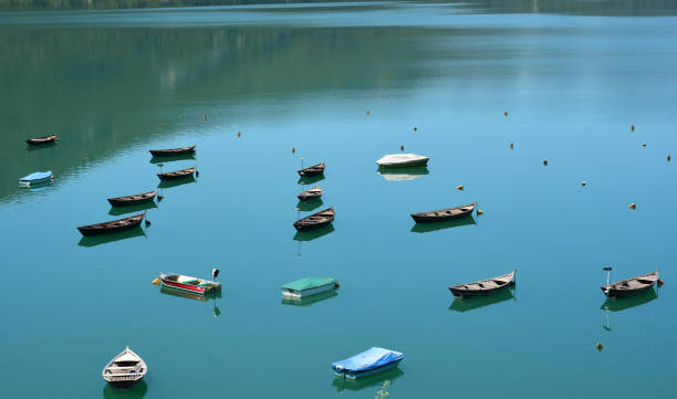 ancient boats moored on the lake shore