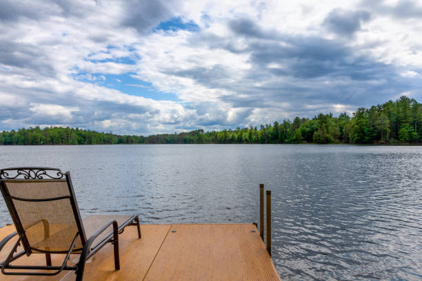 istock Dock and Chair on a Northwoods Lake 1251531481