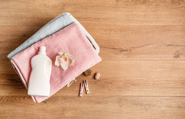 istock Bath towels and detergents on wooden surface 1251531580