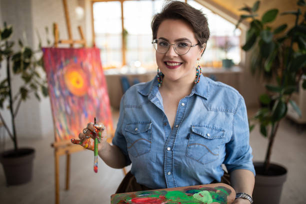 istock Happy female artist at art studio 1251532583