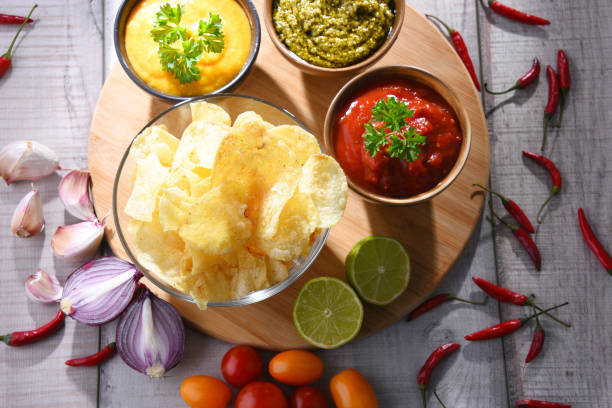 istock Composition with bowl of potato chips. 1251532597