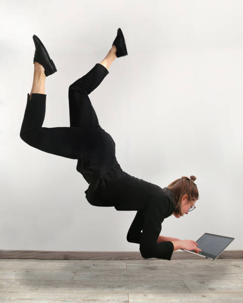 istock Girl levitating in front of the computer 1251534863