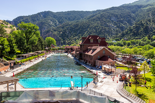 Glenwood Springs, USA - July 10, 2019: High angle view of famous Colorado hot springs pool in downtown with water and people swimming