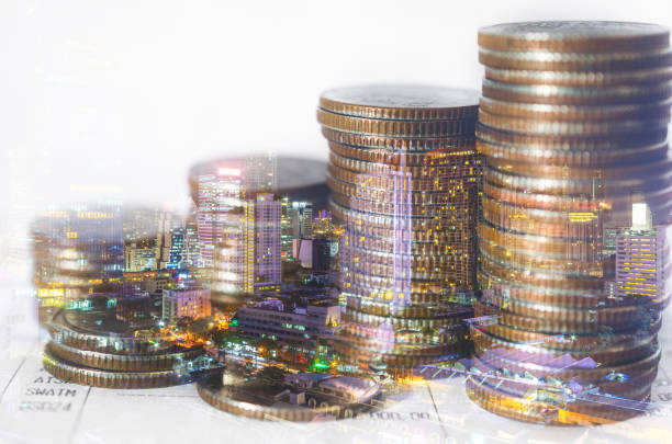 double exposure of city with row of coin stack for business investment finance banking and money saving concept. double exposure of city with row of coin stack for business investment finance banking and money saving concept. trader wall street stock market analyzing stock pictures, royalty-free photos & images