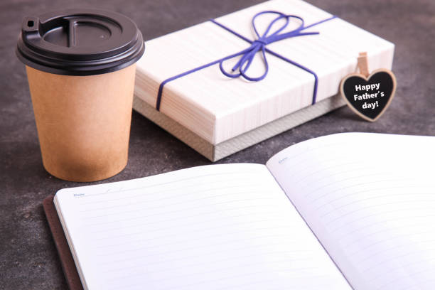 istock Men's notepad, disposable cup with coffee and gift 1251538788