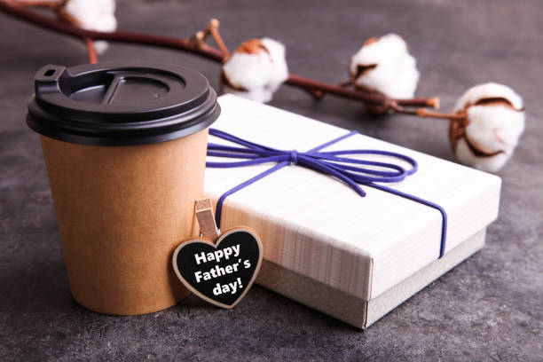 istock Beige gift box and disposable cup with coffee 1251538805