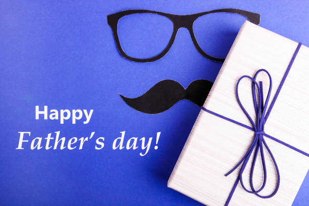 istock Beige gift box and paper mustache with glasses 1251538814
