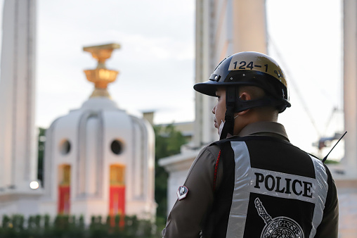 Bangkok, THAILAND - June 23, 2019: Police and BMA Law Enforcement stand guard around The Democracy Monument before event memorial Siamese revolution of 1932 at 05.00 on June 24, 2019.