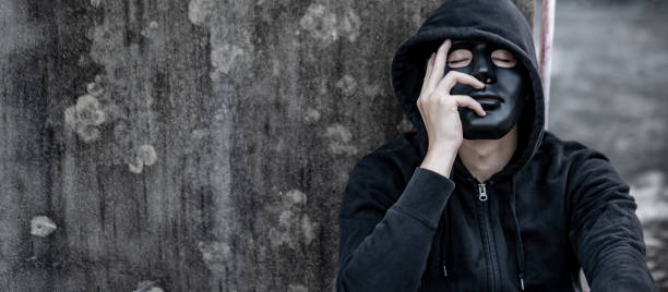 istock Mystery man in black mask feeling stressed 1251541268