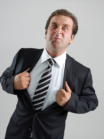 Angry businessman in suit making a gesture