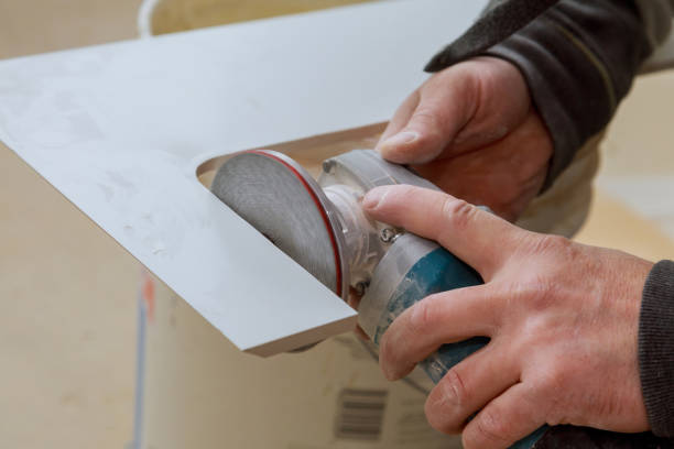istock Worker in uses grinder for cutting tiles porcelain stoneware work 1251542956