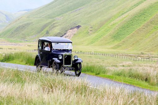 Moffat, Scotland - June 29, 2019:  Austin Seven car in a classic car rally en route towards the town of Moffat, Dumfries and Galloway