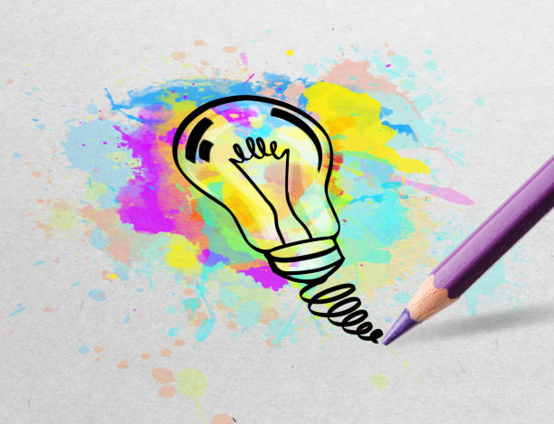 istock Pencil drawing colorful bulb on paper 1251546006