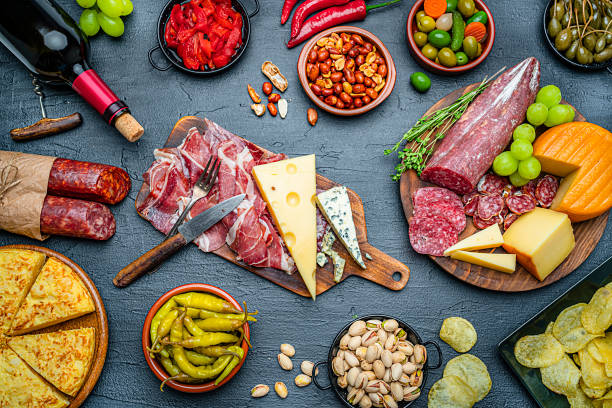 istock Tapas: large group of delicious appetizer on dark background 1251547336