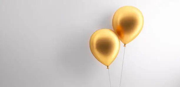 Two Golden Balloons in Front of a white Wall with copy space - 3D illustration