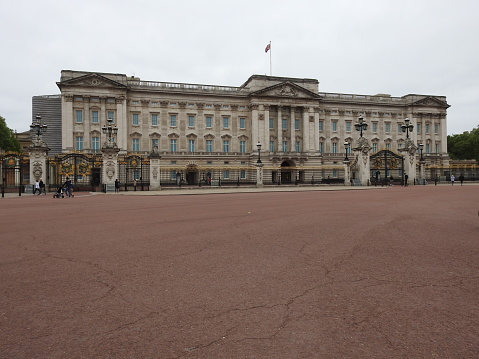 Famous and the main symbol of London Buckingham Palace and The Union Jack flag is flying at half-mast