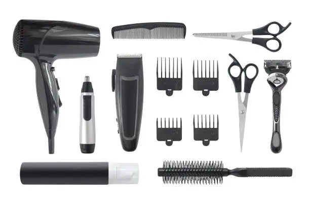 Top view of professional hairstyle and grooming kit isolated on white background. Hair clipper, hair dryer, combs and other hairdressing equipment