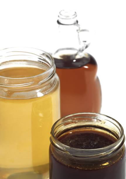 istock Mapple Syrup, Molasses and Honey Pots against White Background 1251549282