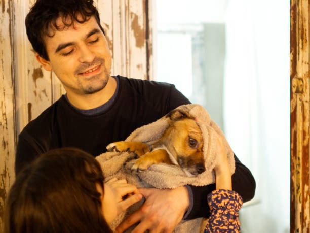 istock father with his daughter drying his dog 1251551721