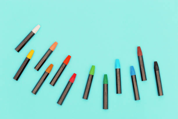 istock Top view of colored pastel crayons. Set of multicolored chalks for creativity. Work space for drawing. 1251554930