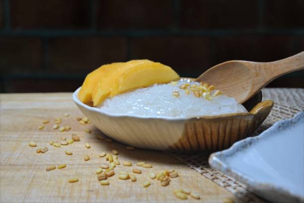 istock Sweet sticky rice with mango on brick wall background 1251555543