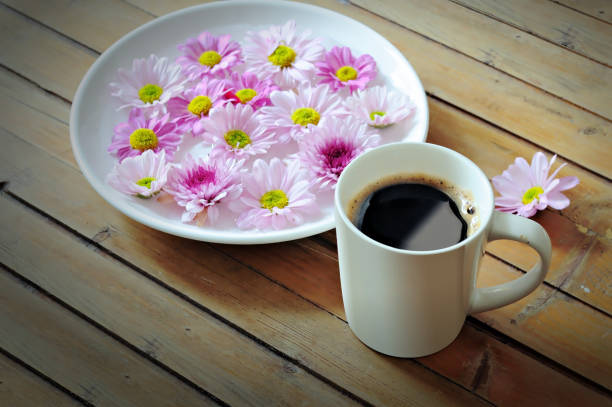 istock coffee Placed with fresh flowers 1251560553