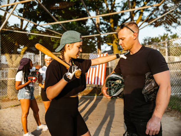 istock Diverse group of young people playing softball 1251564486