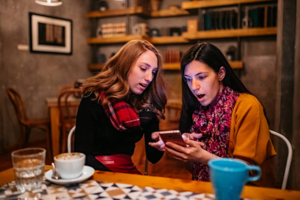 istock Shocked women reading a text message on mobile phone 1251565691