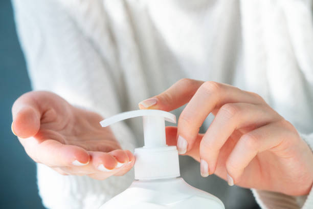 istock Woman using antibacterial hand gel 1251567996